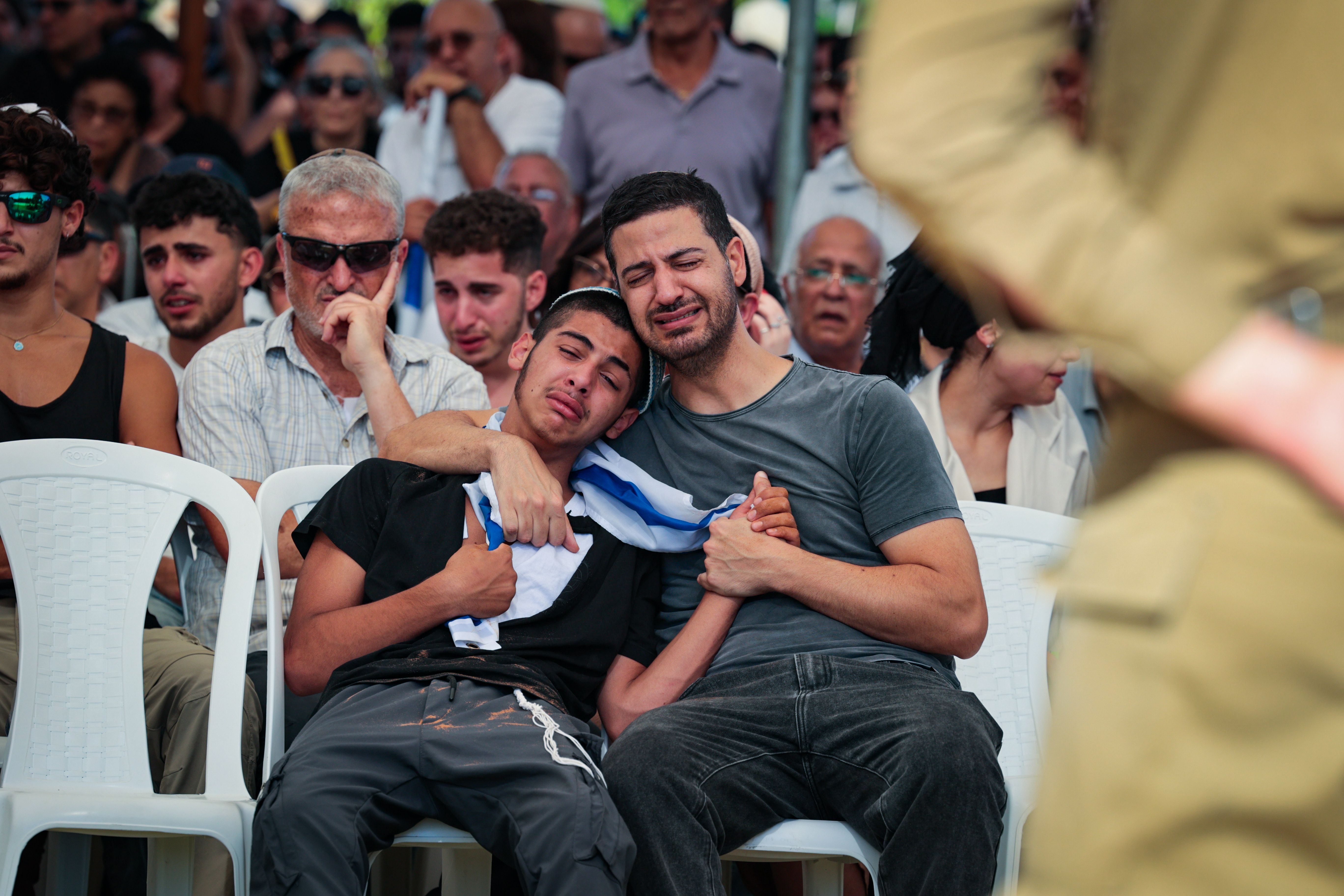 Family and friends of Israeli soldier Staff sergeant Ronel Ben-Moshe attend his funeral at the Military Cemetery in Rehovot on June 25, 2025. He was killed in combat in the Gaza Strip.