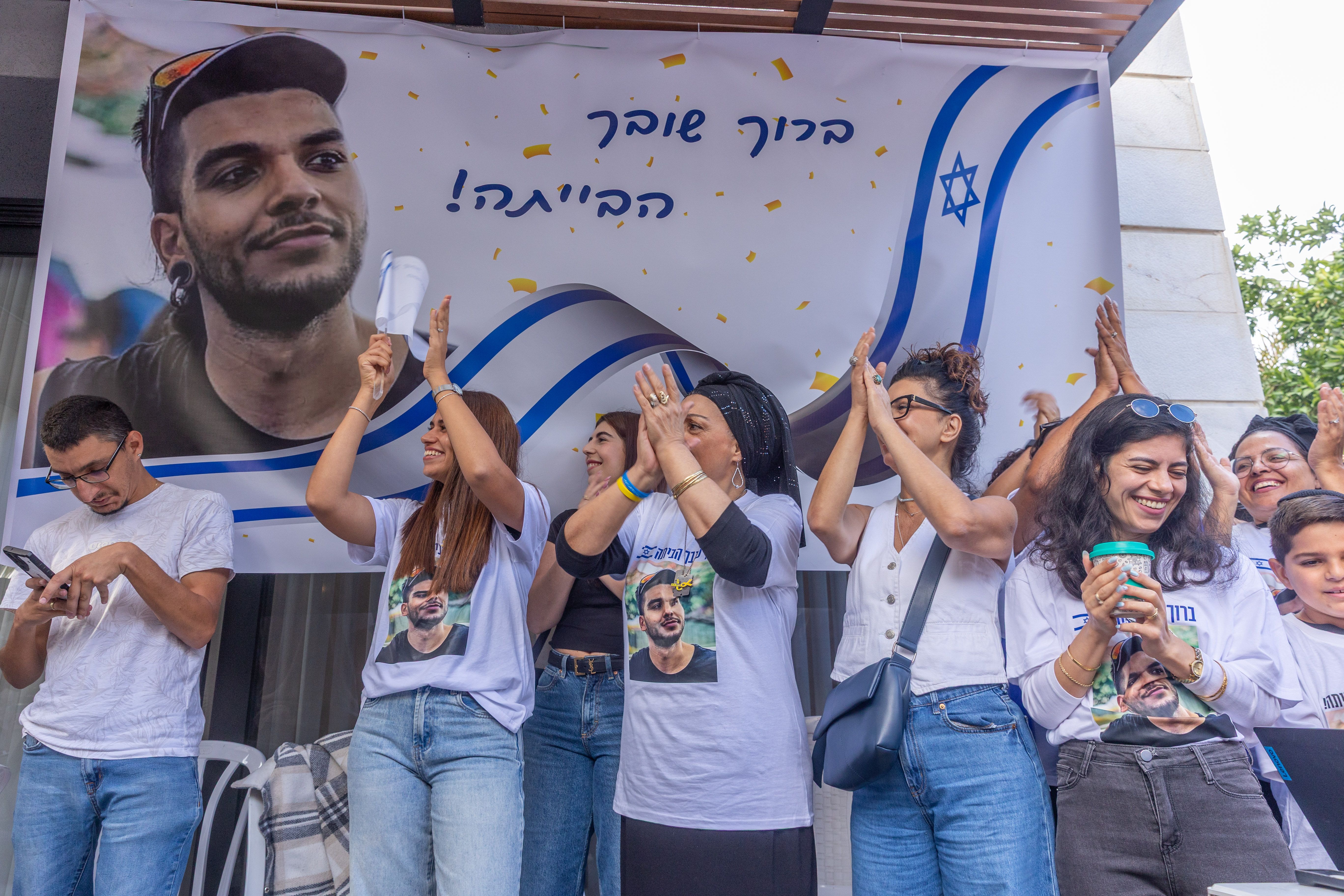 Family and friends of Israeli hostage Yosef Chaim Ohana watch his release from Hamas captivity in Ramla, October 13, 2025. 
