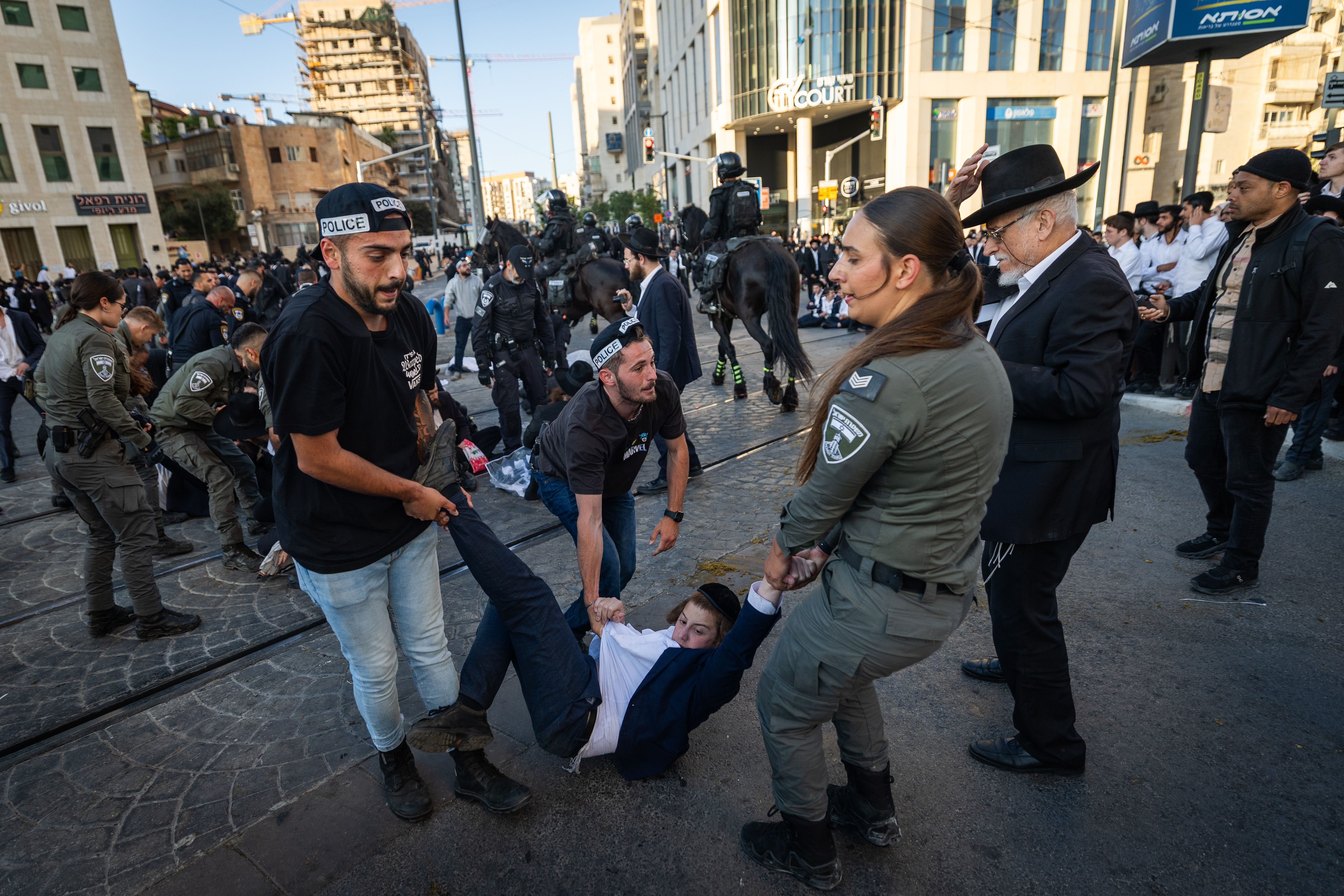 Ultra orthodox Jews protest and clash with police during a protest against the drafting of ultra orthodox jews to the Israeli army, outside a conference of ultra-Orthodox soldiers in Jerusalem, May 5, 2025.