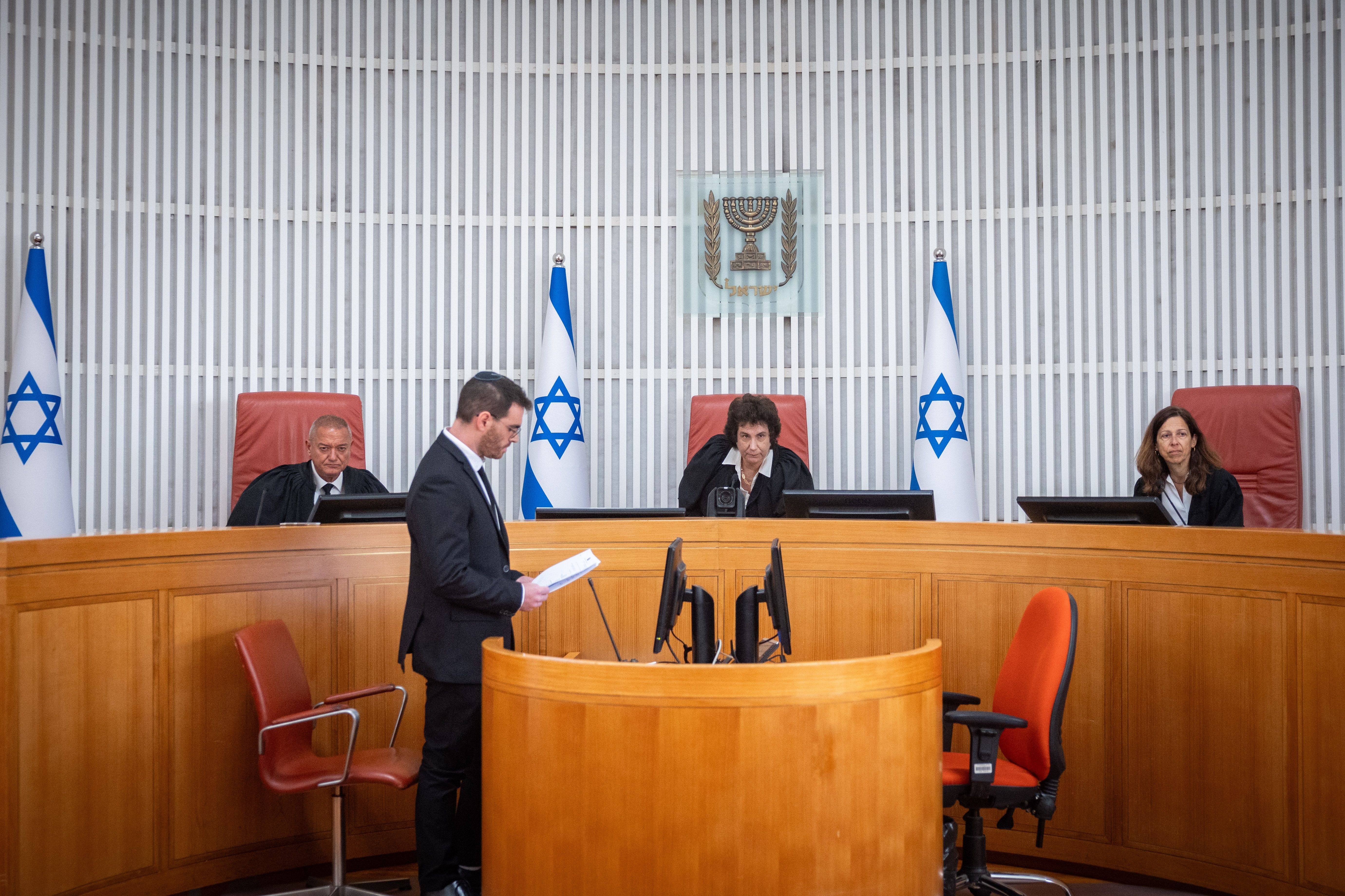 Supreme Court justices hearing a petition regarding Haaretz newspaper