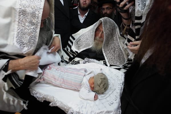 Illustration: The rebbe of Sadigora takes part at a circumcision ceremony in the city of Bnei Brak