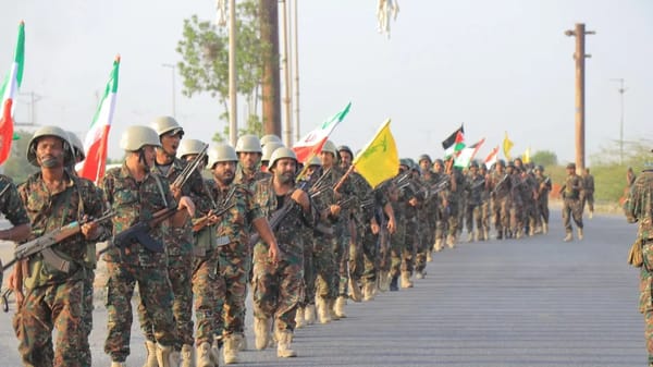 Houthis holding Iranian flag