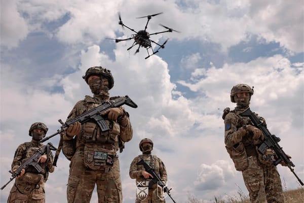 Uk soldiers with drone above them