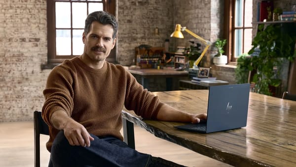 Henry Cavill with Google's laptop