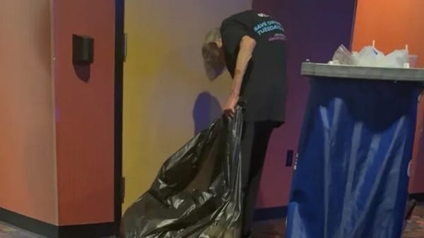 The elderly worker during her shift at the cinema