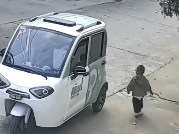 Child Climbs into Running Car and Drives Toward Busy Road as Mother Watches