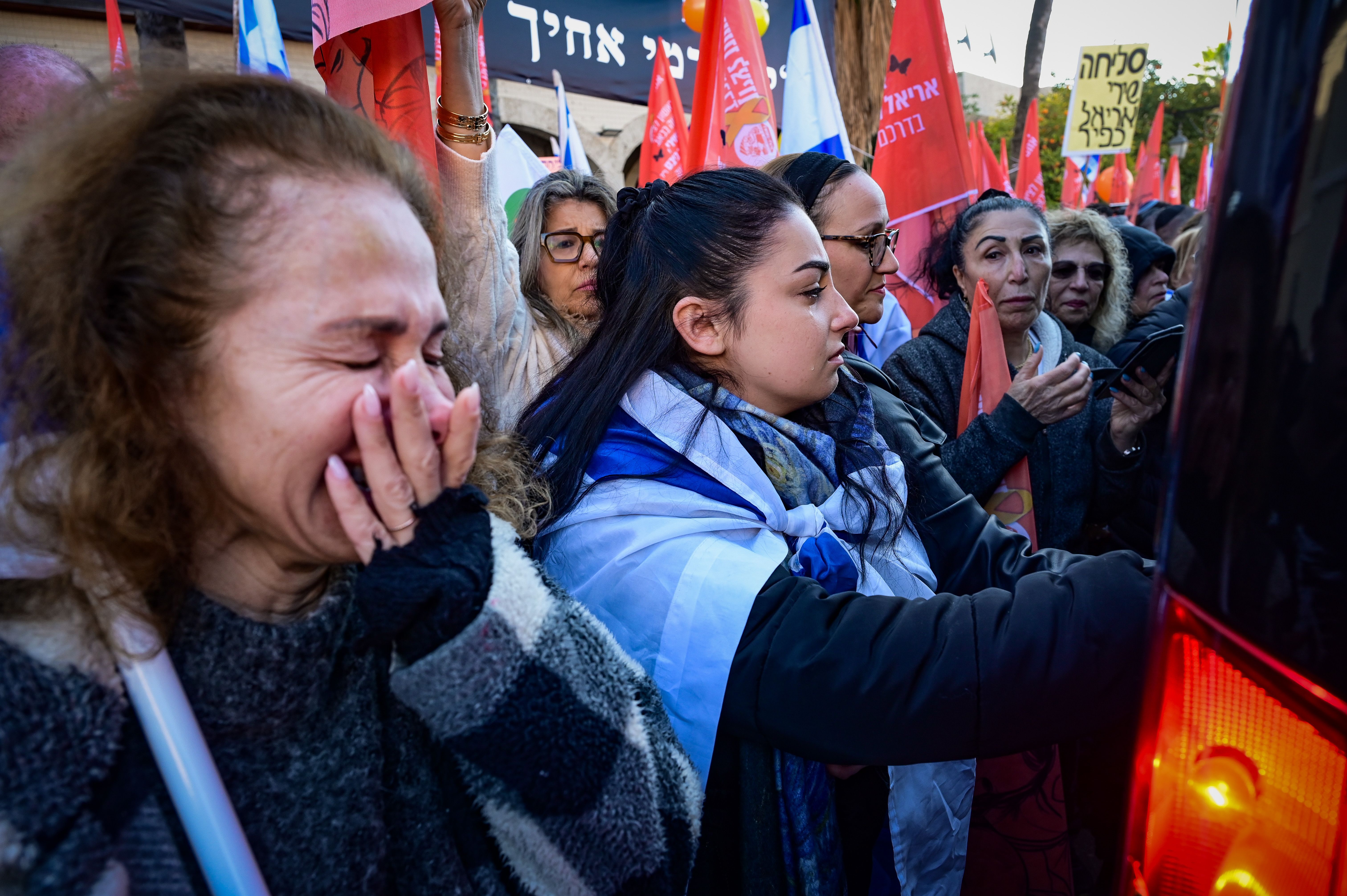 People pay their respects during the funeral service of late Israeli hostages Shiri Bibas and her children Ariel and Kfir in Rishon LeZion, February 26, 2025