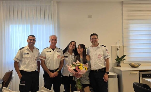 Toni with the paramedics who saved her life