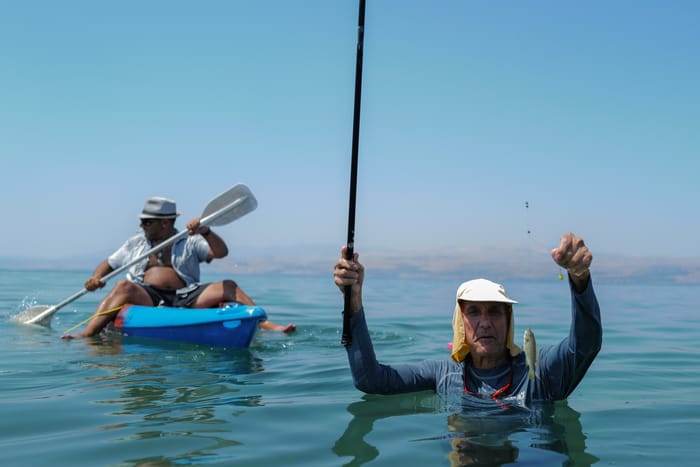 Fisherman fishing at the Diamond Beach in the the Sea of Galilee, on September 5, 2023.