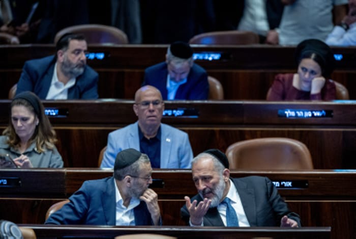 MK Moshe Gafni speaks with MK Aryeh Deri in the Knesset on June 11, 2024.