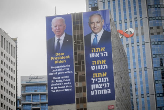 Large billboards of Israeli PM Benjamin Netanyhau and US President Joe Biden , in Ramat Gan, March 4, 2024.