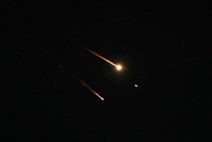 Anti-missile system fires interception missiles as drones and missiles fired from Iran.