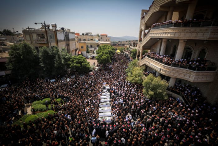 Family and friends attend the funeral service of druze children killed from a missile fired from Lebanon, Majdal Shams July 28, 2024