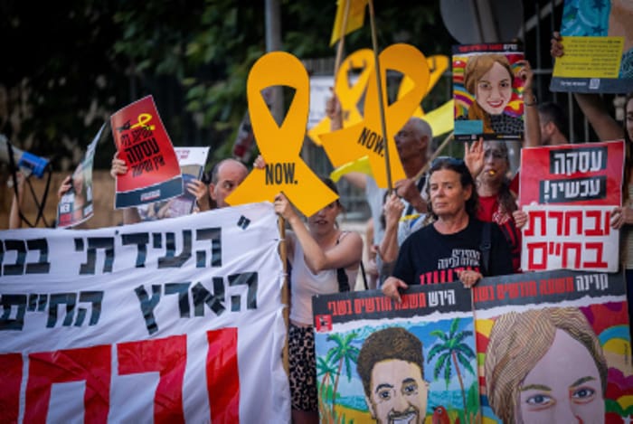 Families of Israeli observation soldiers who were kidnapped by Hamas on October 7 attend a protest