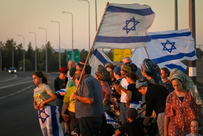 Israelis gather with national flags at 100 locations nationwide to strengthen the country's unity, Hispin, Golan Heights, on August 8, 2024.
