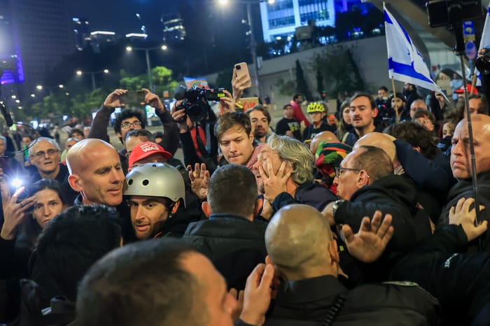 Demonstrators protest against the Israeli government and for the release of Israelis held hostage in the Gaza Stripc outside Hakirya Base in Tel Aviv, January 11, 2025. 