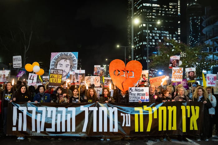 People gather outside Hakirya base in Tel Aviv, on the day of the release of the bodies of four Israeli hostages from Hamas captivity, February 20, 2025