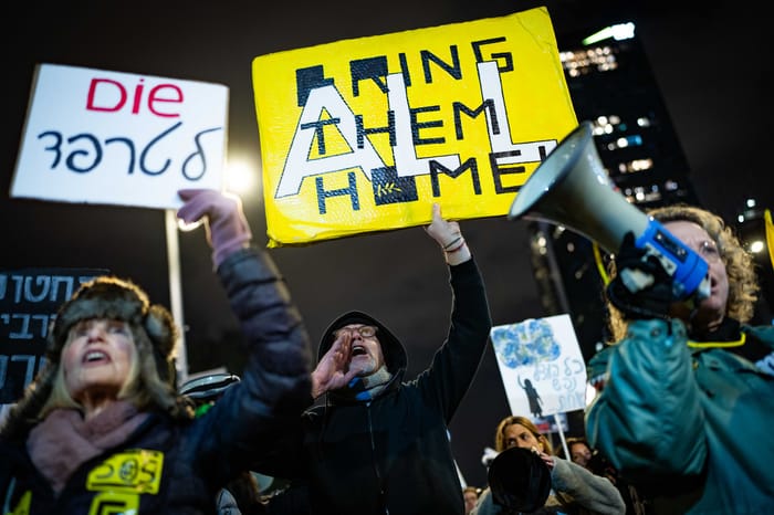 Demonstrators protest for the release of Israelis held hostage in the Gaza Strip, outside Hakirya Base in Tel Aviv, February 22, 2025