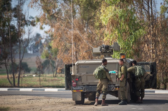 Israeli soldiers stand guard in Nahal Oz, southern Israel