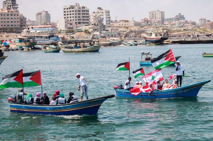 Gazans in boats off of Gaza port