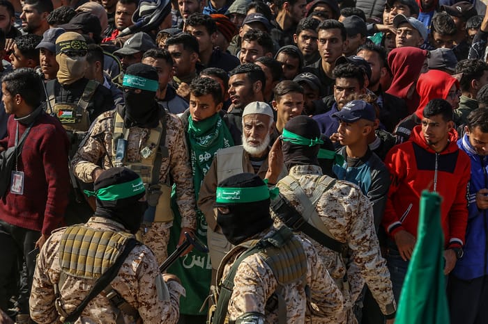 Hamas, Islamic Jihad and thousands of People outside the house of Sinwar in Khan Younis, where two Israeli hostages and 5 Thai hostages were released to the Red Cross as part of a deal between Israel and Hamas, January 30, 2025.