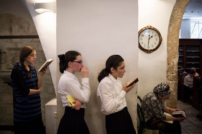Religious Jewish girls praying
