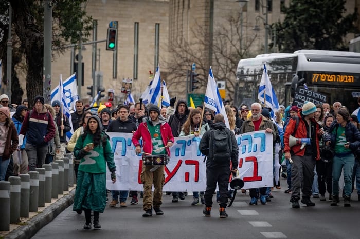 Demonstrators protest march against the Israeli government vote to fire Shin Bet Chief Ronen Bar and against Israeli Prime Minister Benjamin Netanyahu in Jerusalem, March 21, 2025. 