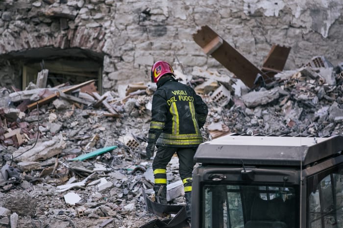 Rescue team member working through the rubble following the earthquake