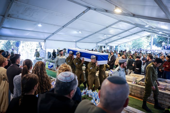 Family and friends of Israeli soldier Staff sergeant Zamir Burke attend his funeral at Mount Herzl Military Cemetery in Jerusalem on December 1, 2024. He fell in battle in the Gaza Strip.