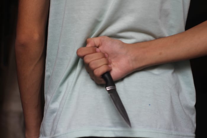 Stab in the back.