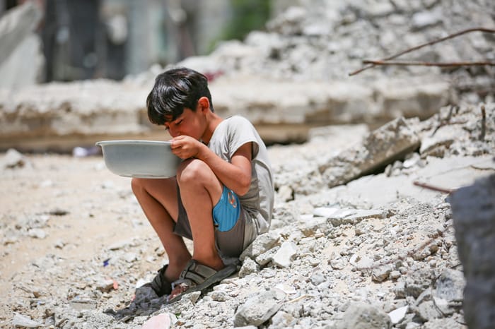 Child eating aid.