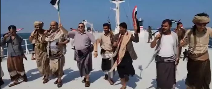 Houthis dancing on the deck of a hijacked vessel