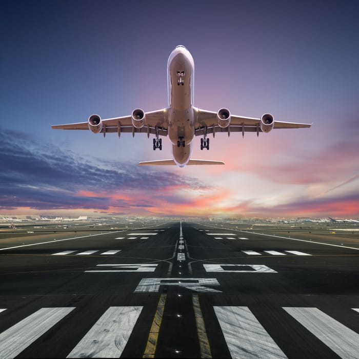 Airplane taking off from the airport, front view.