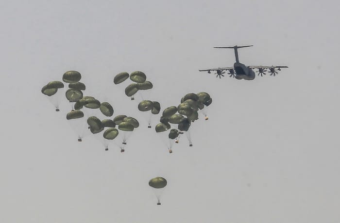 Airdropping aid.