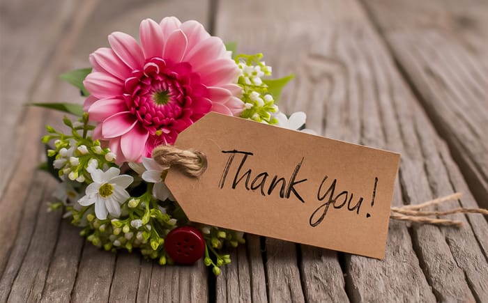 A thank you card with colourful flowers
