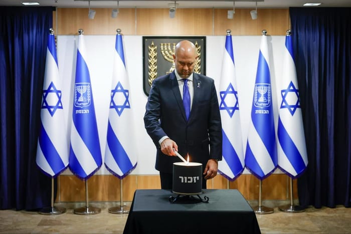 Knesset Speaker Amir Ohana led the early tributes, lighting a memorial lamp at the entrance