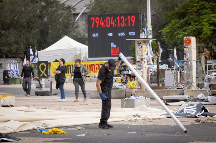 Workers dismantle installations at Hostage Square in Tel Aviv on December 9, 2025.
