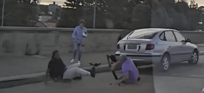 Boris and Sofia Gurman attempting to stop terrorist Sajid Akram as he emerges to begin shooting.