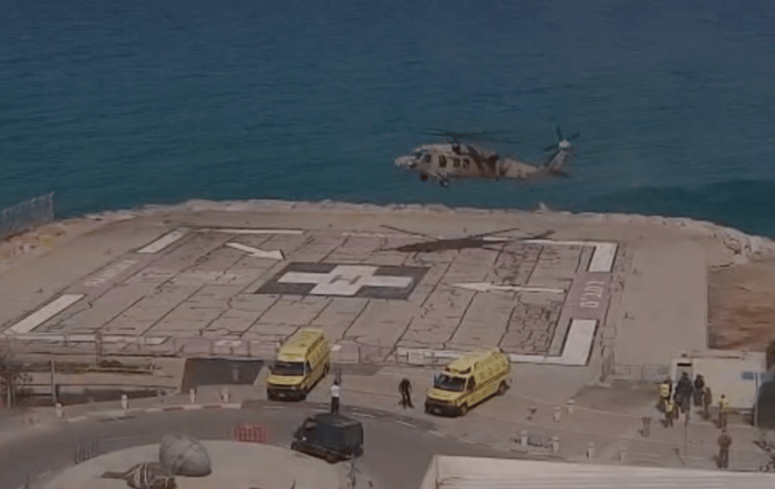 Helicopter transports 2 wounded soldiers