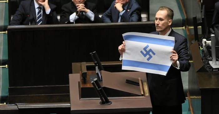 Man holds up Israeli flag with swastika in place of Star of David