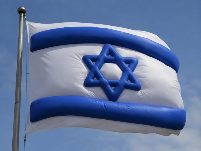 An overweight Israeli flag. Illustration.