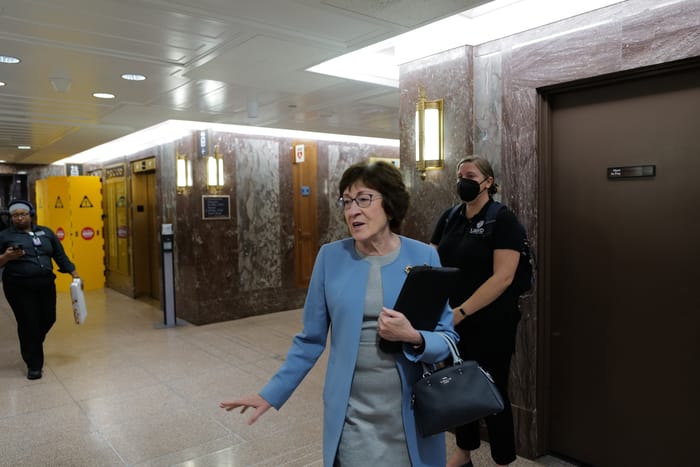 Senator Collins (R-ME) speaking to constituents in the Senate office building.