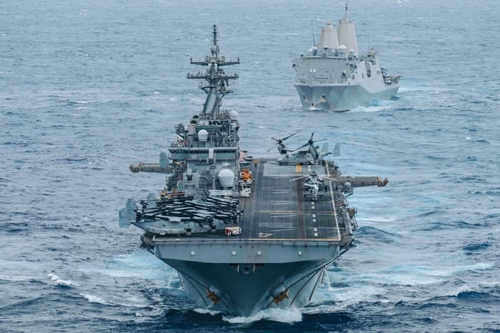 USS Boxer (LHD 4) and USS Portland (LPD 27) sail in formation while transiting the Indian Ocean,
