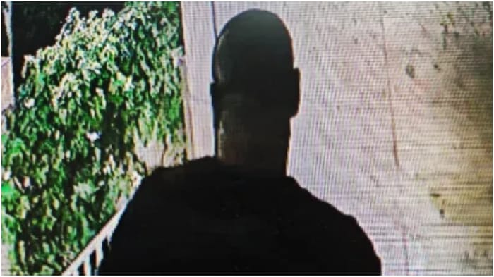 Murder suspect leaving the house of his victim