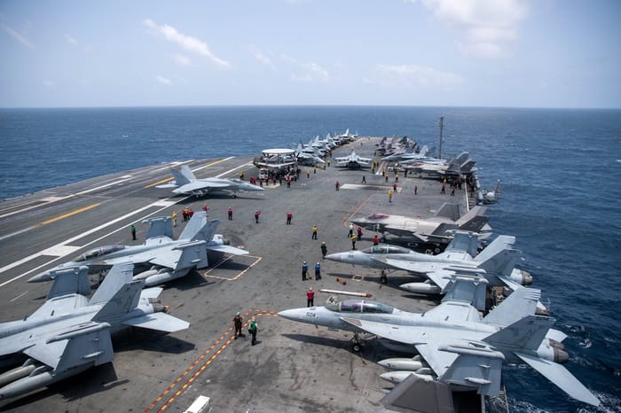 An aircraft carrier in the Gulf facing Iran.