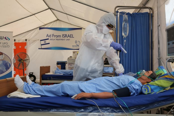 Training exercise on treating Ebola patients – illustration.