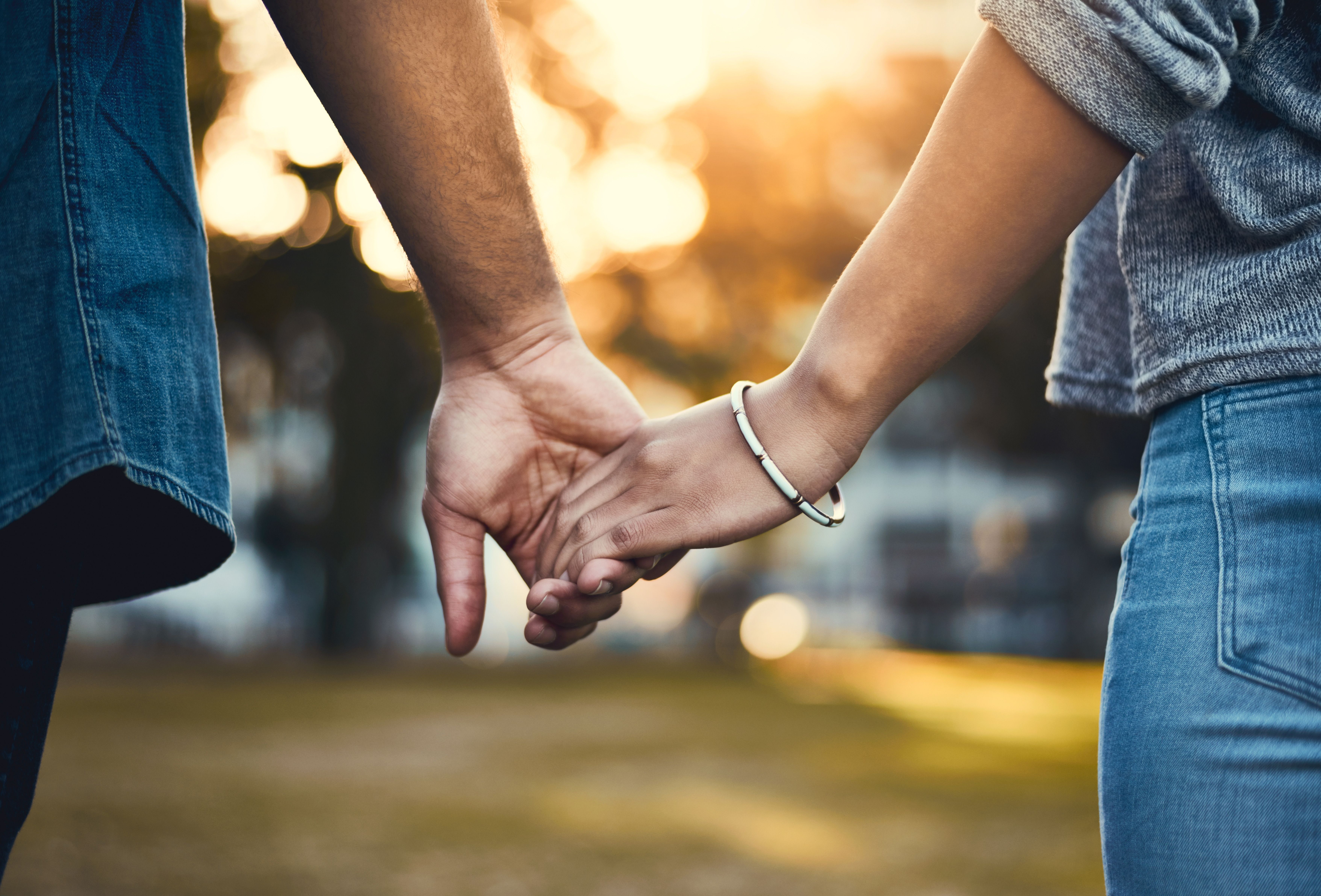 Couple holding hands