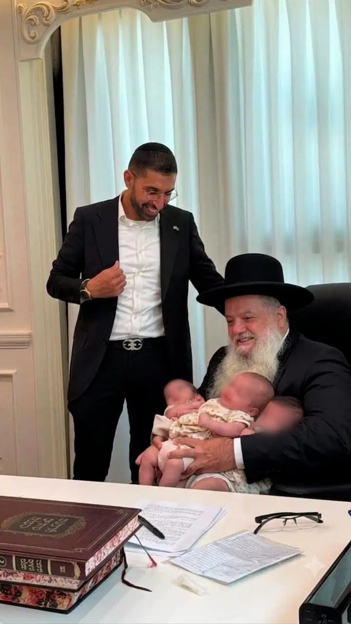 Rabbi Cohen with the triplets