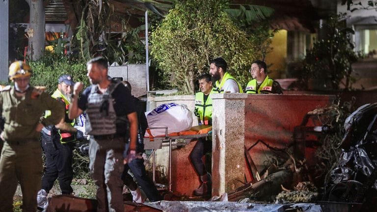 Bodies pulled from the rubble after Iranian missile strike