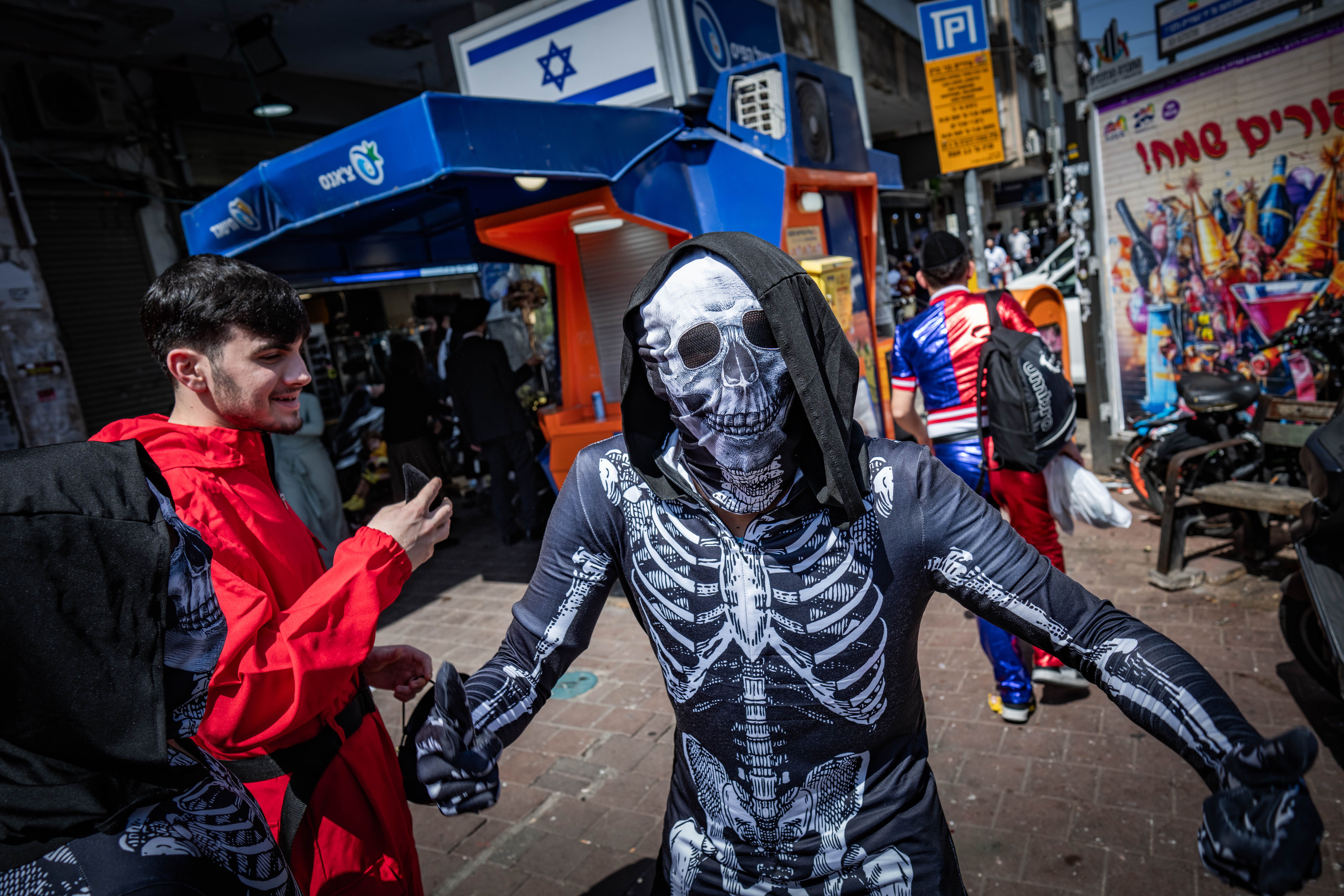Ultra Orthodox Jews celebrate the Jewish festival of Purim, in the ultra-Orthodox town of Bnei Brak on March 14, 2025.